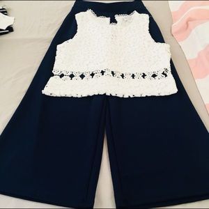 Blue pants and white top